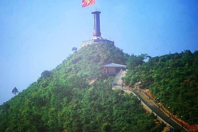 The path leading up to the flagpole is made of stone steps