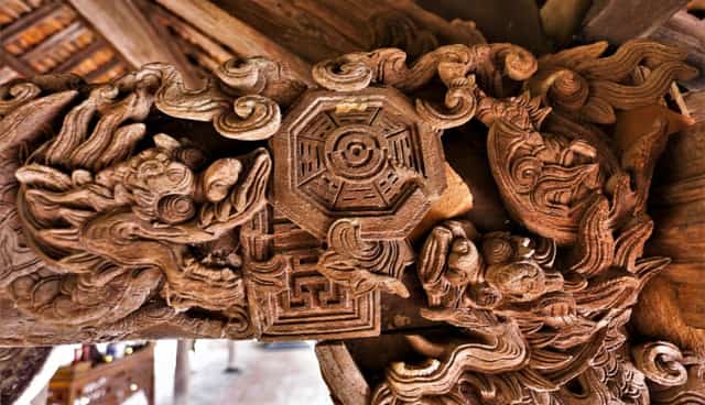 Exquisite, elaborate, and highly artistic carvings on jackfruit wood, arranged with harmonious symmetry.