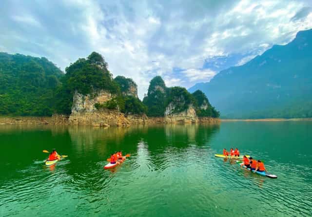 Visitors enjoying the stunning scenery within the hydroelectric lake