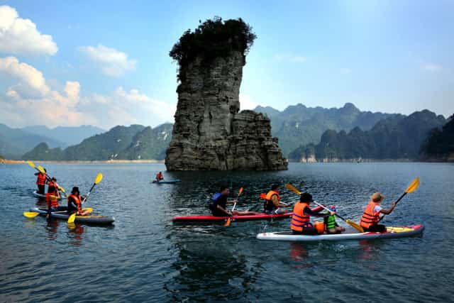 Tourists kayaking in Lam Binh