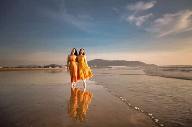 Early morning visitors at Cửa Lò Beach, enjoying the tranquil sunrise.