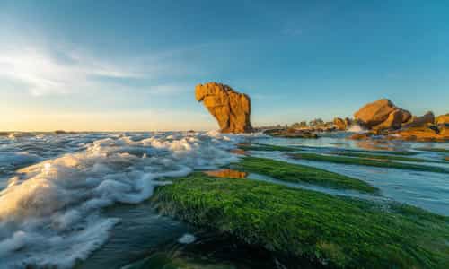 Colorful Pebbles and Mossy Rocks: The Allure of Co Thach Beach